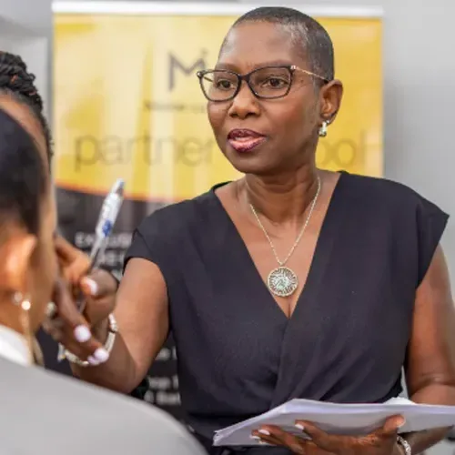 Sharon Wint-Levy consulting with a client