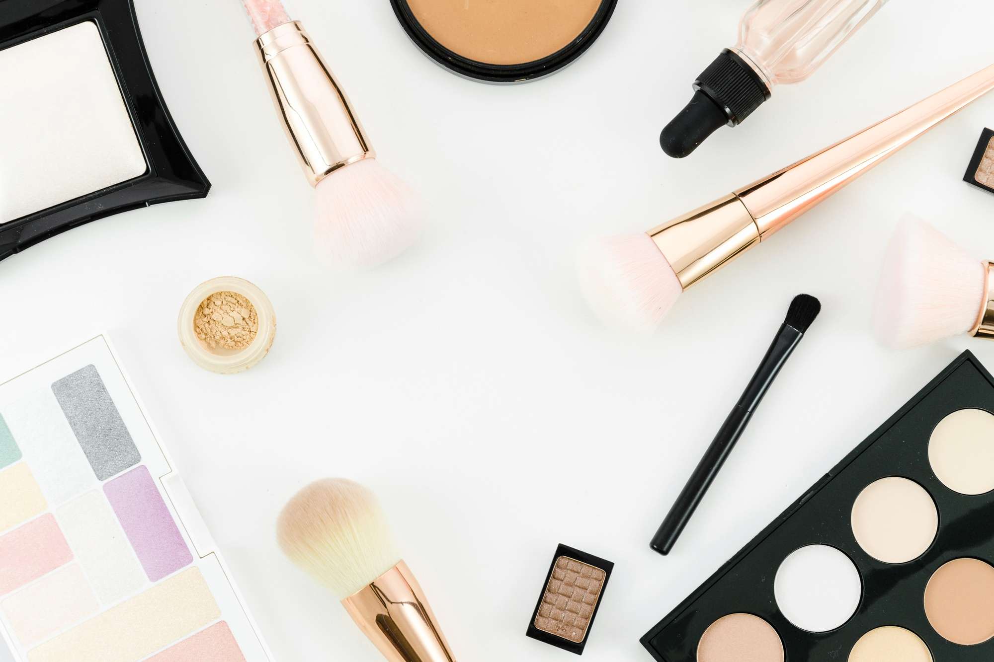 Assortment of makeup products and brushes
